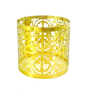 Detailed view of elegant gold hollowed metal lampshade with baroque style cutout patterns