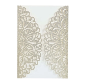 Intricate laser-cut silver glitter wedding invitation cover with mandala lace patterns