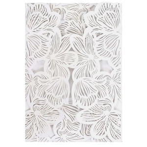 Laser cut white wedding invitation card with intricate hollow floral patterns and elegant finish