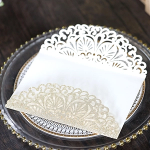Detailed laser-cut floral white invitation with sparkling rose gold glitter accents