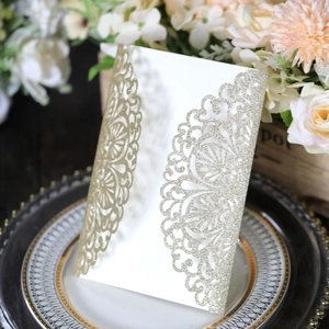 Detailed laser-cut rose gold glitter wedding invitation sleeve with hollow lace pattern