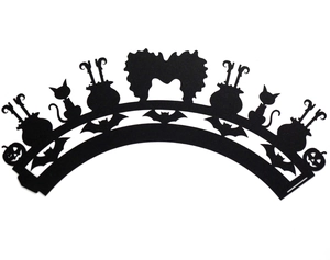 Detail of laser-cut black Halloween cupcake wrappers with bats and pumpkins