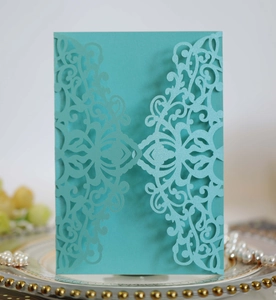 Detail showing laser-cut floral pattern on Tiffany blue card with pearl accents