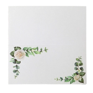 Detailed view of white wedding place cards with rose floral print and folding design