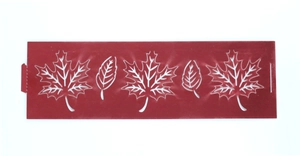 Detail view of red hollow stencil template with maple leaf patterns for DIY candle decoration