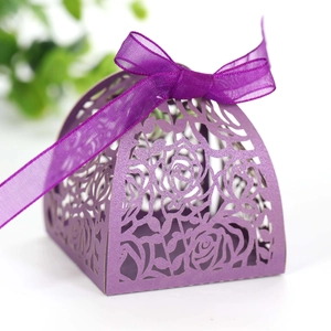 Detail of purple laser-cut rose gift box with pearlescent finish and satin ribbon bow