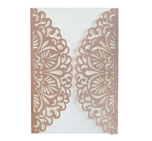 Detailed laser cut lace pattern on rose gold glitter wedding invitation card cover
