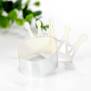 Macro shot of silver reflective crown napkin rings with metallic finish for parties