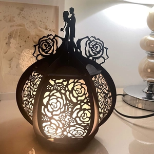 Romantic hollow rose paper lantern with couple silhouette and warm yellow light