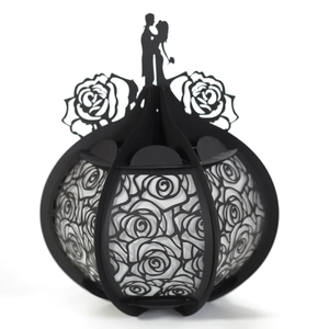Black laser-cut pumpkin carriage gift box with romantic rose pattern and couple silhouette