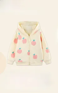 Close-up of kids zip-up hoodie featuring pink peach prints and ribbed cuffs and hem