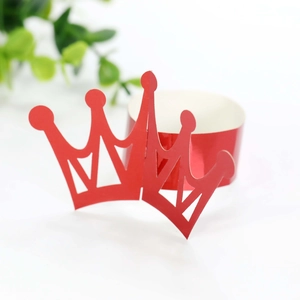 Close-up of vibrant red crown-shaped paper cupcake wrappers for festive party decorations