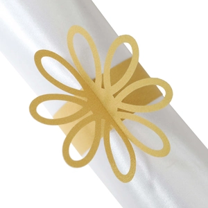 Elegant gold laser-cut paper napkin rings in floral shape for wedding table decoration