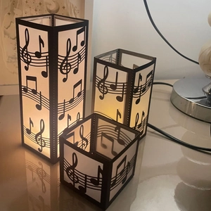 Three-piece black music note paper lanterns with laser-cut musical staves and notes