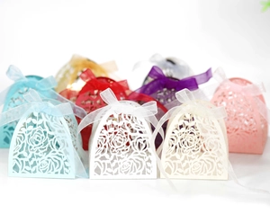 Laser-cut rose hollow candy boxes in multiple colors with sheer organza ribbon ties