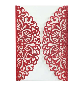 Detail of red glitter laser-cut lace wedding invitation cover with mandala pattern
