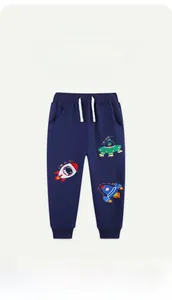 Detail of navy boy's joggers with elastic drawstring waist and space rocket embroidery