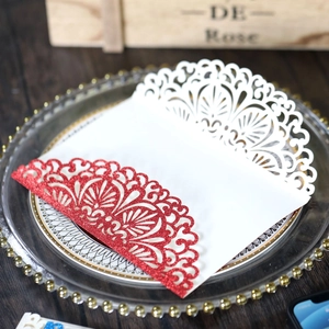 Detailed laser-cut lace pattern on rose gold glitter wedding invitation card cover