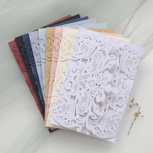 Laser cut floral wedding invitation covers in multiple colors with elegant texture