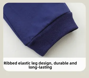 Detail view of elastic ribbed cuffs on boys' navy knit pants for durable wear