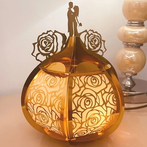 Exquisite golden paper lamp box with hollow rose patterns and romantic kissing couple silhouette