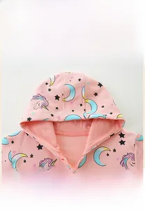 Detail of toddler girls pink hooded jacket featuring unicorn print and mesh lining