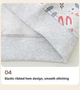 Detail of grey girl hoodie showing elastic ribbed hem and neat stitching with heart prints