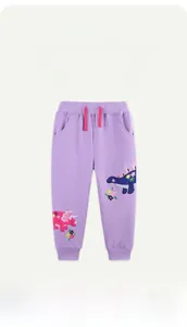 Broderie détaillée de dinosaures sur un pantalon de jogging violet en coton fille