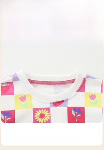 Detailed view of the strawberry checkered rib knit neckline on a girls' sweatshirt
