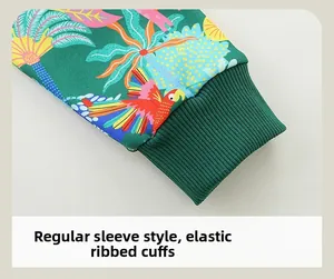 Close-up of elastic ribbed cuffs on a green tropical parrot print sweatshirt for boys