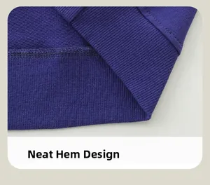 Detail of ribbed hem on dark blue knit sweatshirt featuring precise stitching and clean seams