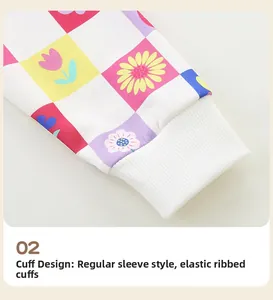 Detail of girls' sweatshirt elastic ribbed cuffs and colorful floral rainbow print