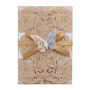 Elegant laser-cut khaki wedding invitation with gold ribbon and blue butterfly detail