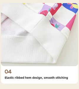 Detail of elastic ribbed hem on girl sweatshirt featuring strawberry and butterfly prints