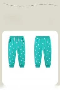 Détail du pantalon de jogging vert à fleurs pour fille avec taille élastique et cordon