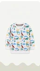 Détail du sweat-shirt blanc pour enfant avec motifs dinosaures colorés et bords-côtes