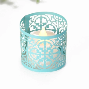 Detail of Tiffany blue laser-cut paper candle holder with warm LED tea light