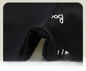 Detail view of cotton leggings featuring cartoon cat print and durable crotch stitching