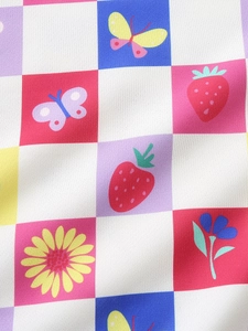 Girls' colorful sweatshirt with checkered print featuring strawberries and floral patterns