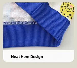 Detail of blue ribbed hem and cute animal patch with neat stitching on a cotton sweatshirt