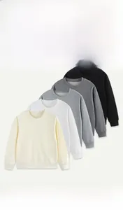 Detail of soft cotton crewneck sweatshirts for kids in multiple neutral colors