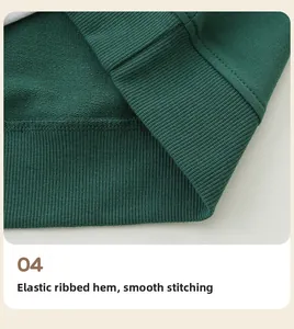 Detail view of the ribbed hem and smooth stitching on this green girl's sweatshirt