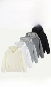 Stacked collection of kids hoodies in beige, white, grey, and black showing color options