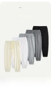 Detail showing five colors of soft cotton drawstring joggers for children's comfort
