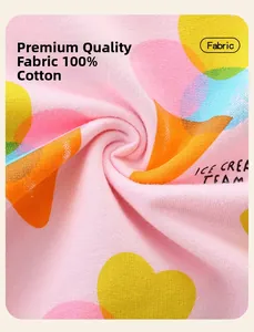 Detailed macro view of pink 100% cotton fabric with colorful heart and dot prints