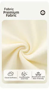 Detail view of premium 100% cotton knit fabric texture in soft cream color