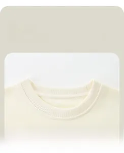 Detailed macro view of the soft ribbed crew neck and stitching on children sweatshirt