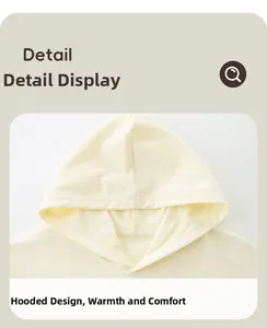 Detail of cream knit hoodie neckline and cozy hood design for children's autumn wear