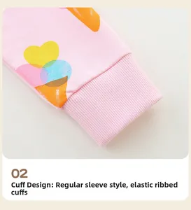 Detail showing elastic ribbed cuffs and cute ice cream print on pink cotton sweatshirt