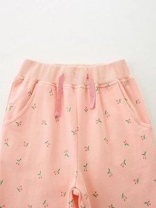 Pink girl's cotton sports joggers with red cherry print and drawstring elastic waist